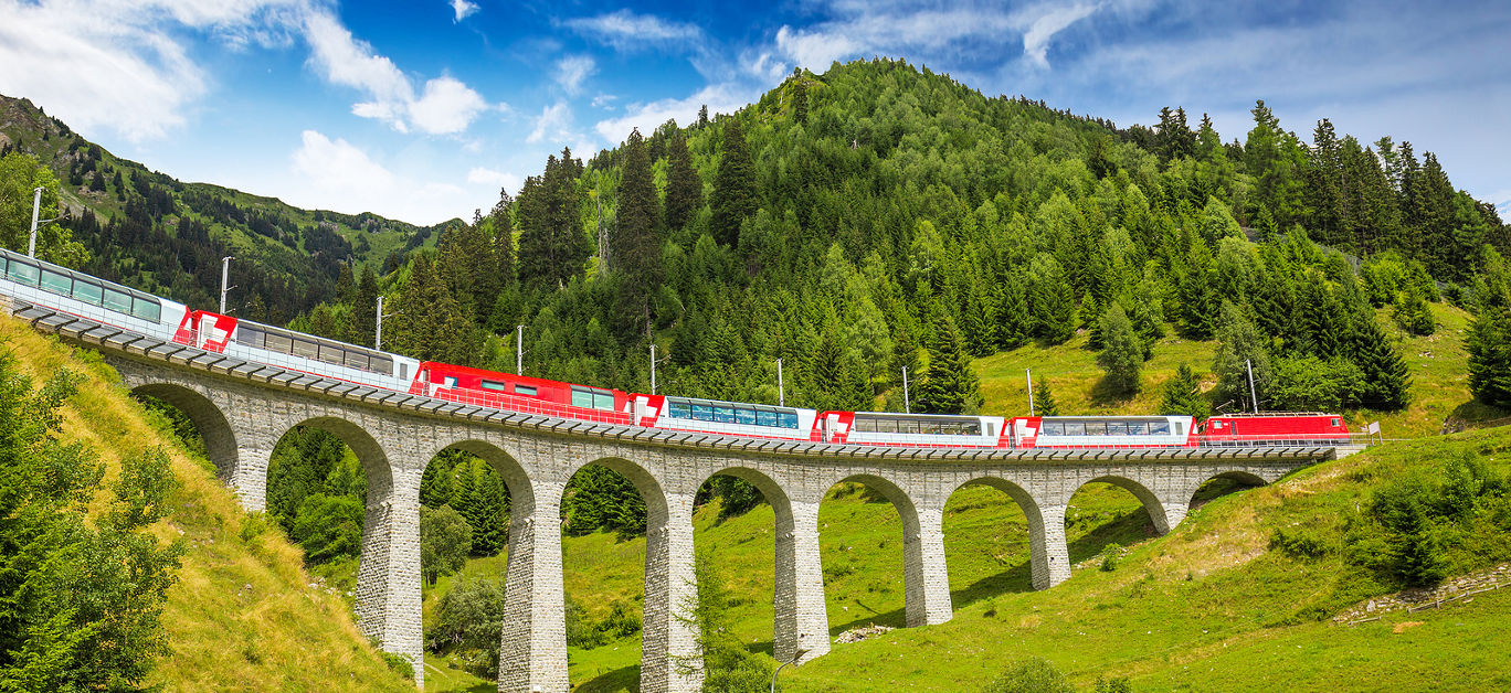 Luxury train traveling through European countryside